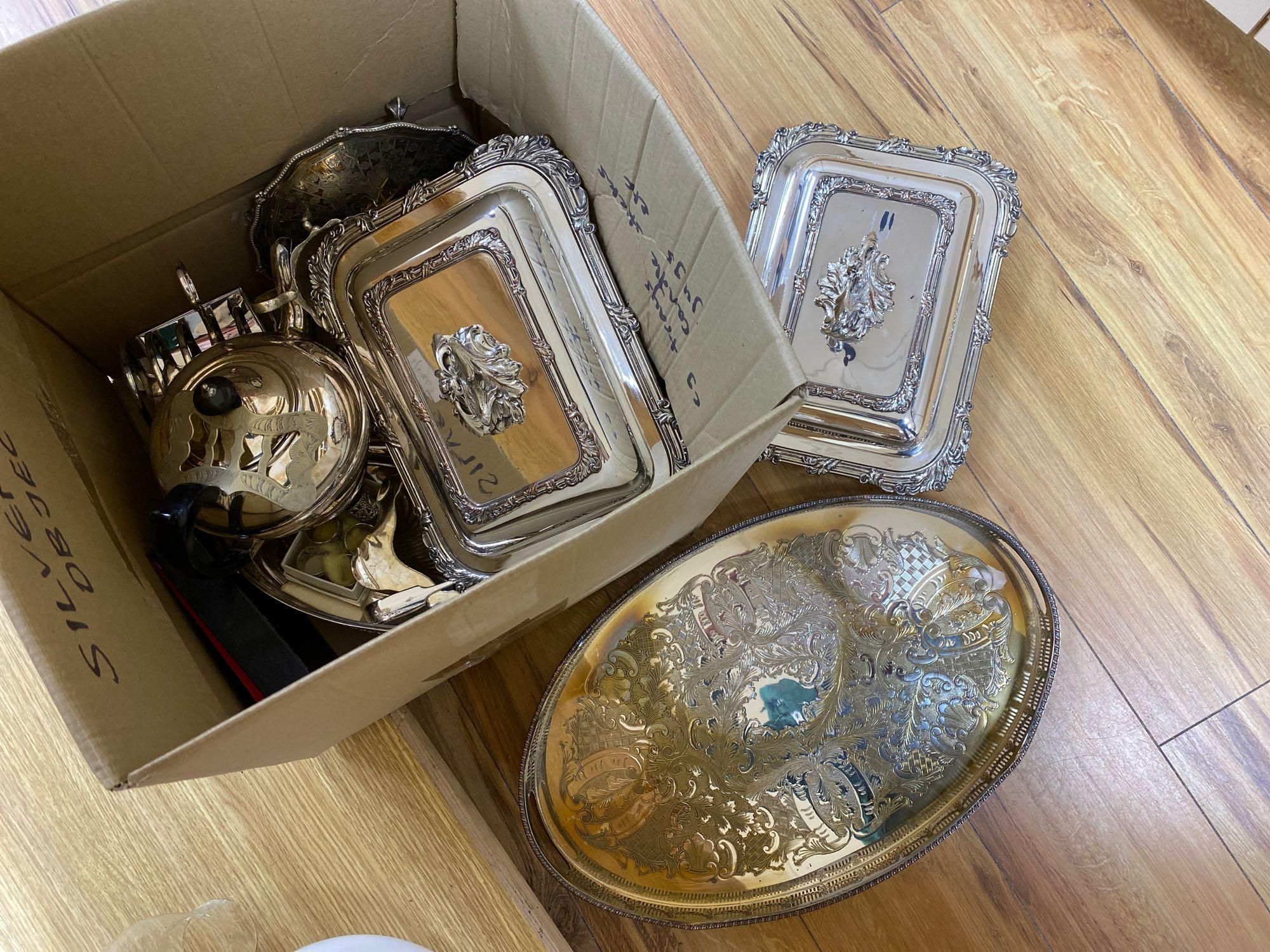 A silver sauce jug, a pair of Victorian plated entree dishes with covers and other plated wares